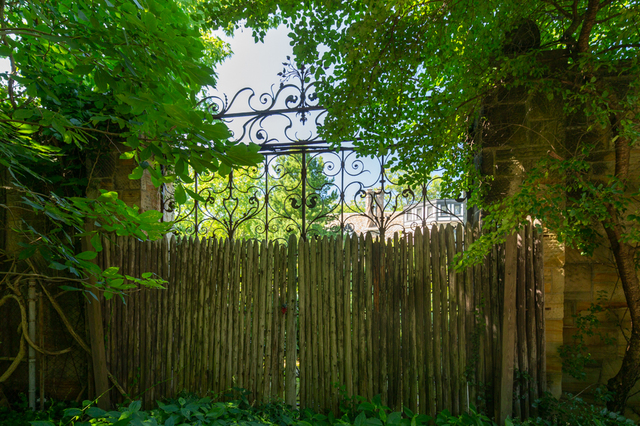 Contemporary photograph of one of two decorative wrought iron gates designed and crafted by Rose Iron Works