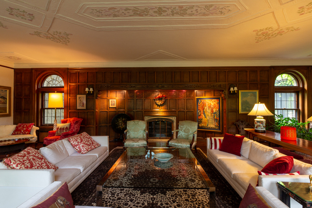 Contemporary photograph of the living room and fireplace at the Van Sweringen mansion